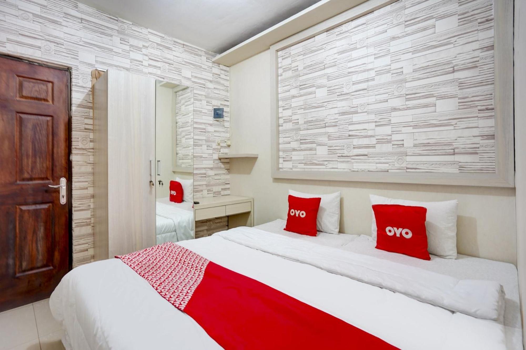 Hotel Oyo Life 90606 Glass House Citraland Syariah