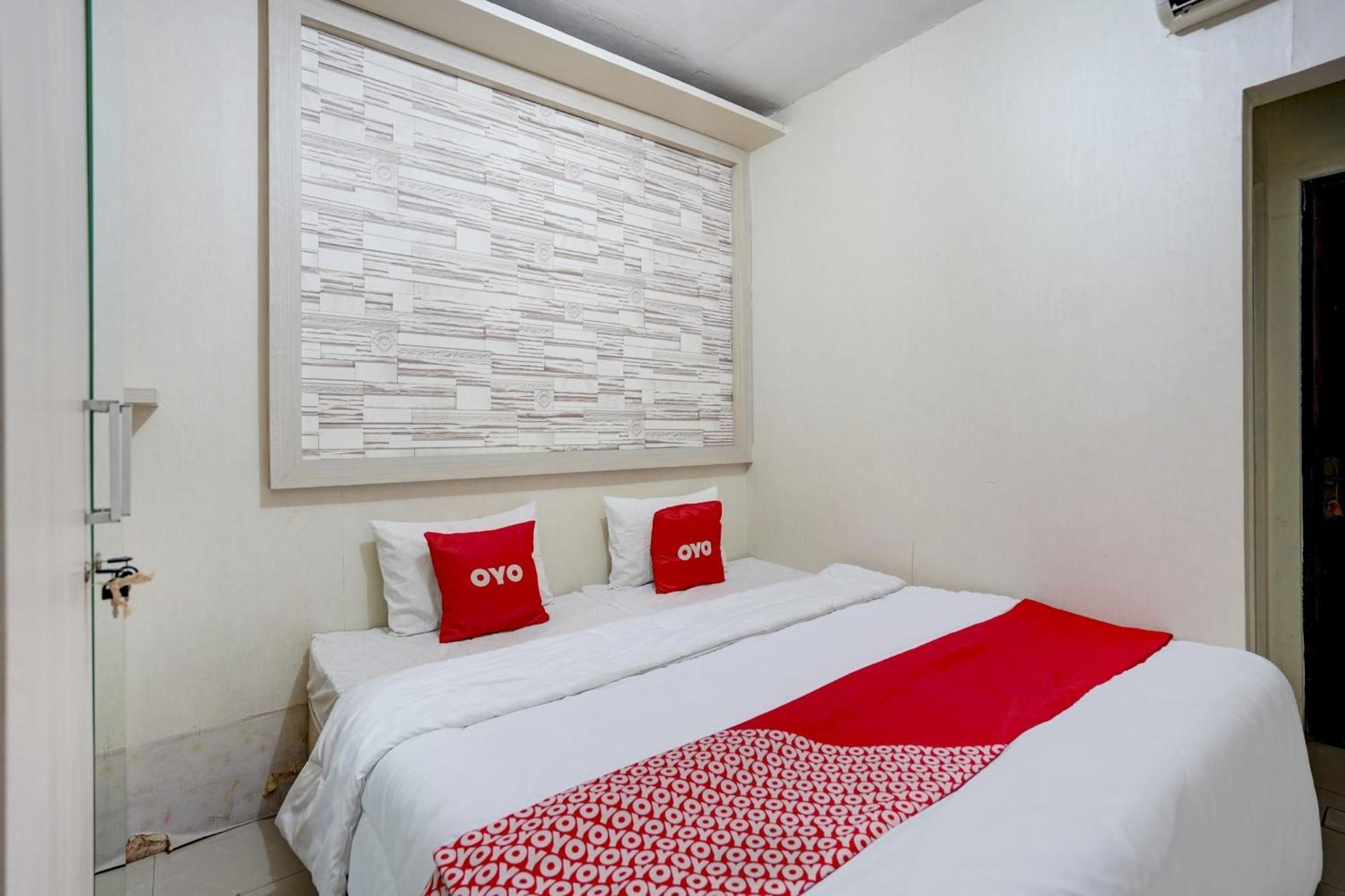 Oyo Life 90606 Glass House Citraland Syariah 2*